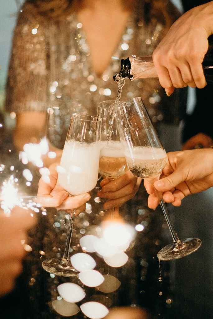 The image shows 3 glasses of champagne. 9 Sparkling Facts About Champagne.